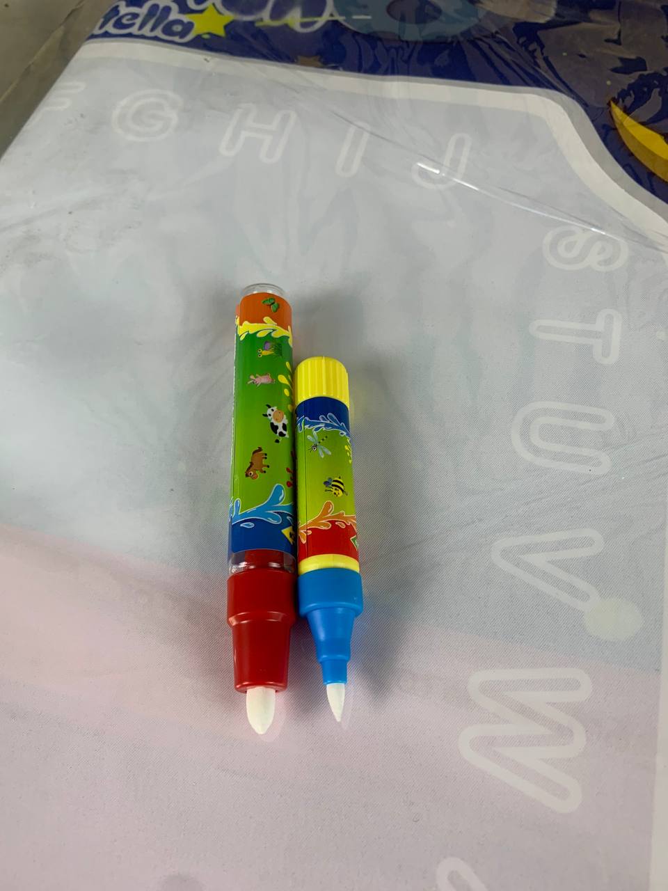 Reusable and washable water coloring mat for kids with alphanumeric practice area