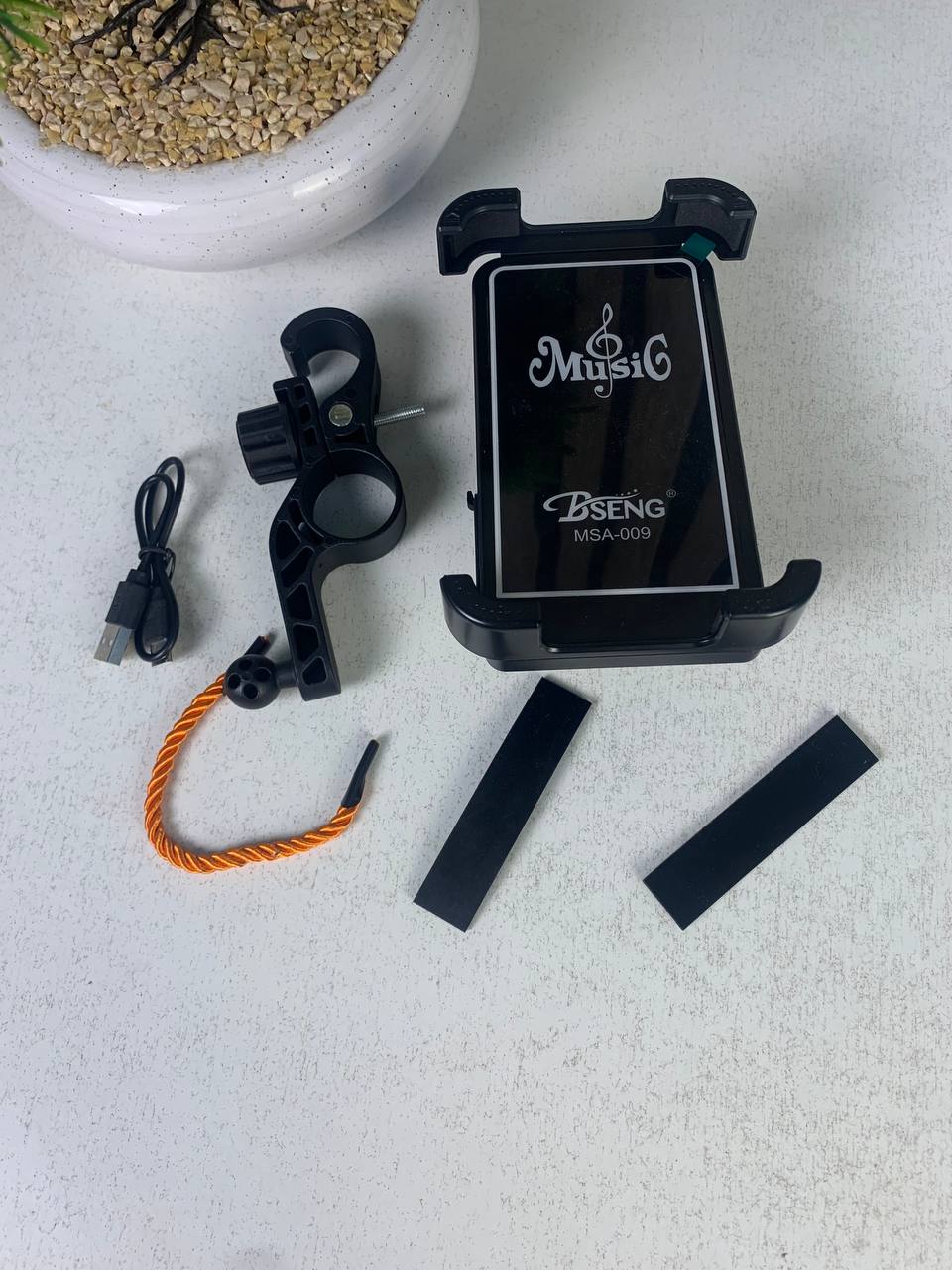 Phone stand with speaker and wireless charger