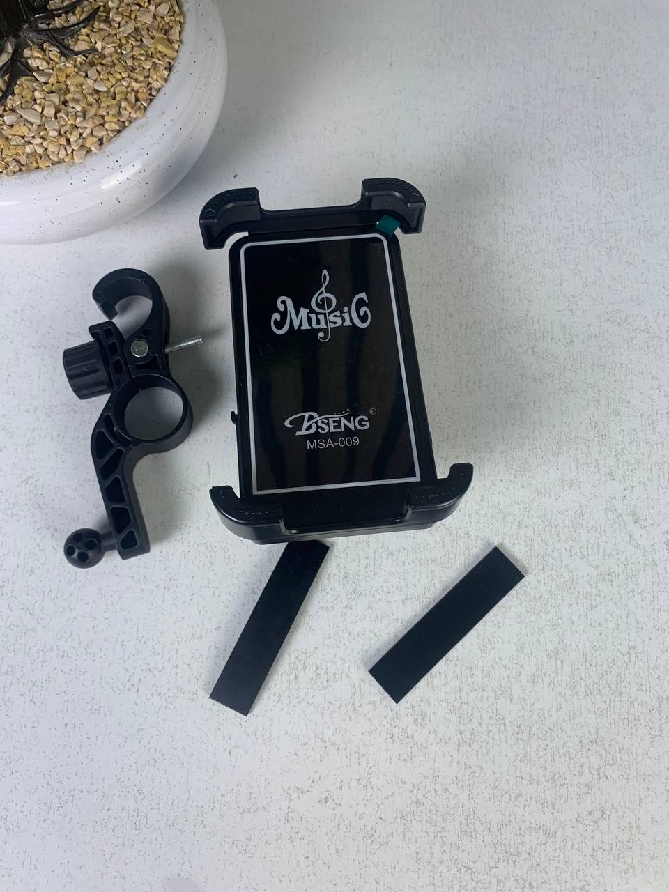 Phone stand with speaker and wireless charger