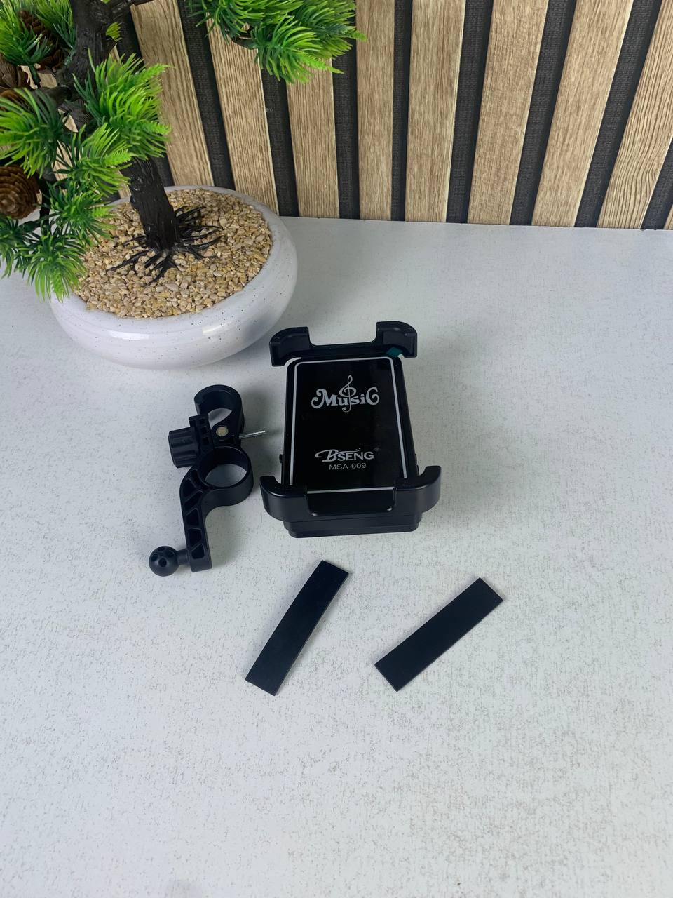 Phone stand with speaker and wireless charger